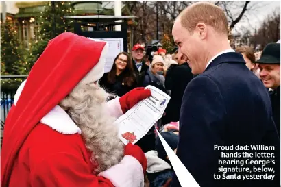  ??  ?? Proud dad: William hands the letter, bearing George’s signature, below, to Santa yesterday