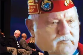  ?? NWA Democrat-Gazette/CHARLIE KAIJO ?? Medal of Honor winner Lt. Col. Bruce P. Crandall (second from left) smiles Thursday as a video plays showing stories from Medal of Honor recipients at the Arend Arts Center at Bentonvill­e High School. The recipients visited area schools, including the...