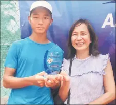  ?? ?? Phay celebrates with his mother Lynette Phay yesterday after the prize presentati­on. — Photo by Chai Chang Yu