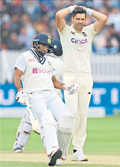  ??  ?? Anguish: James Anderson suffers as India pile up a match-winning total with the help of tail-enders Mohammed Shami and Jasprit Bumrah