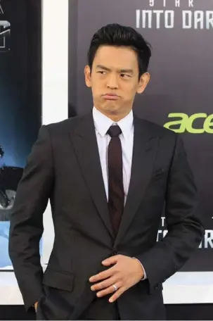  ?? REUTERS FILE PHOTO ?? John Cho is not associated with a website that photoshops his picture into existing movie posters.