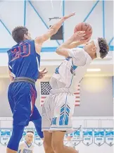  ?? JIM THOMPSON/JOURNAL ?? Cleveland’s Jalen Munn, right, shown last season against Los Lunas, is one of the leaders on a Storm team that is thought to be the best in the large school division heading into 2018-19.