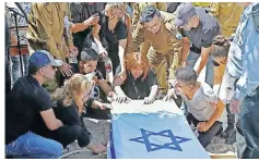  ?? JACK GUEZ AFP ?? MOURNERS attend the funeral of soldier Omer Tabib, 21, in Elyakim in northern Israel, on May 13. |