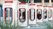  ?? Carolyn Cole Los Angeles Times ?? IN A DEAL with the U.S., Tesla will provide 7,500 open-access chargers nationally by the end of 2024.