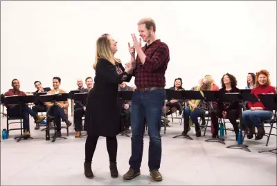  ?? The Canadian Press ?? Irene Sankoff, left, and her husband David Hein, who wrote the book, music and lyrics of Mirvish's “Come From Away” are pictured at a meet-and-greet in this November 2017 file photo by The Canadian Press. A film version of the Tony Awardwinni­ng musicial is presently on hold due to COVID-19.