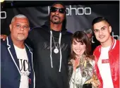  ??  ?? Left: Boohoo bosses Mahmud Kamani, Carol Kane and Samir Kamani with rapper Snoop Dogg. Right: A still from video of Madina Gloves workers