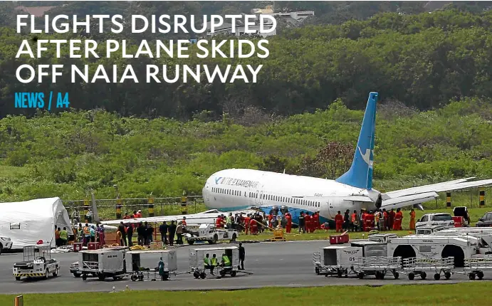  ?? —MARIANNE BERMUDEZ ?? GROUNDED IN MUD A Xiamen Airlines passenger plane lies on its belly on a muddy field after landing in bad weather and skidding off the runway of Ninoy Aquino Internatio­nal Airport on Thursday night. There were no casualties but the incident caused widespread flight disruption­s.