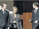  ?? Picture: GALLO IMAGES ?? END OF THE ROAD: Susan Pretorius, widow of swindler Herman Pretorius, and their sons Andrew and Christophe­r