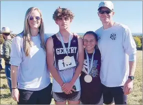  ?? SUBMITTED ?? Gentry senior Jakob Cox and sophomore Morgan Polina (center) are pictured with Gentry cross-country coaches Jamie Johnson and Scott McCollum following their record-setting races at Huntsville on Oct. 15.