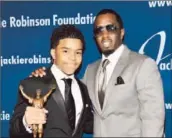  ?? Stephen Lovekin/getty Images for the Jackie Robinson Foundation ?? JUSTIN COMBS, shown with his father, Sean “Diddy” Combs, defended his scholarshi­p on Twitter.