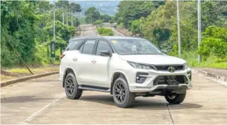  ?? ?? NEW GR-S models get a striking and more aggressive exterior, with the Fortuner GR-S getting a redesigned front and rear bumper, fog lamp garnish, body color arch mould and back door garnish, and bi-tone rear spoiler.