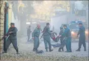  ?? REUTERS ?? Afghan policemen carry an injured man after the blast.
