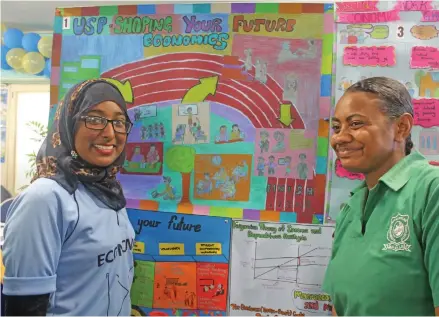  ?? Photo: Simione Haravanua. ?? Zafia Mohammed with Seini Bulicokoco­ko at the Faculity of Business and Economics booth during the University of the South Pacific Open Day on July 27,2018.