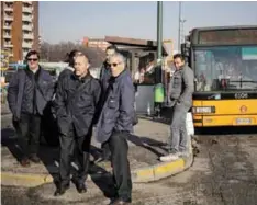  ??  ?? MILAN: People gather near the site where suspected Berlin truck attacker Anis Amri was killed in Milan yesterday. — AFP