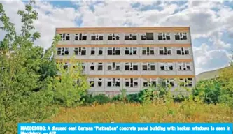  ?? — AFP ?? MAGDEBURG: A disused east German ‘Plattenbau’ concrete panel building with broken windows is seen in Magdeburg.