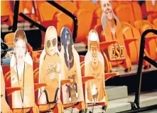  ?? [SARAH PHIPPS/THE OKLAHOMAN] ?? Cardboard fans are pictured during OSU's 75-70 win against Kansas on Tuesday at Gallagher-Iba Arena in Stillwater.