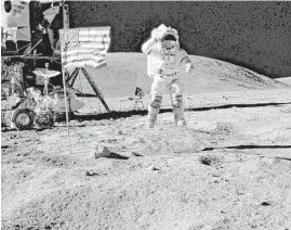  ?? NASA photo ?? John Young salutes the U.S. flag on the moon during the Apollo 16 mission in April 1972. Young, who went on to command the first shuttle mission in 1981 during a four-decade career at the space agency, died at his Houston home on Friday.