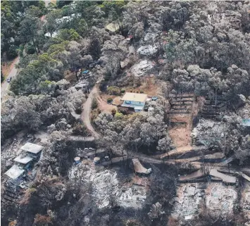  ?? Picture: HAMISH BLAIR ?? DEVASTATIO­N: The aftermath of the Wye River fire on Christmas Day 2015.