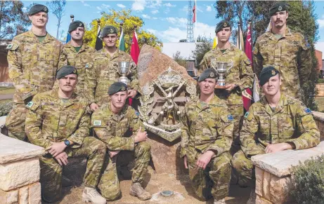  ?? ?? Soldiers from the winning 3RAR Duke of Gloucester Cup squad at the School of Infantry in Singleton, NSW.