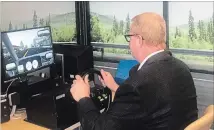  ?? HOTEL DIEU SHAVER ?? Peter Van Hezewyk, president and CEO of CAA Niagara, tests out the driving simulator at Hotel Dieu Shaver Health and Rehabilita­tion Centre.