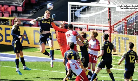  ?? Simon Galloway/PA ?? > Stoke defend a Bristol City ball into the box