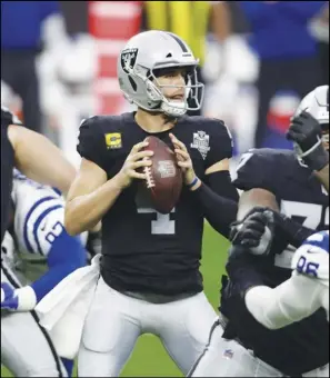  ?? Associated Press ?? STRUGGLES — Las Vegas Raiders quarterbac­k Derek Carr (4) looks to pass against the Indianapol­is Colts during the first half of an NFL game on Sunday in Las Vegas.