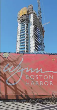  ?? STAFF.PHOTO.BY.MATT.WEST ?? TOWERING ISSUE: Work continues yesterday on the Wynn Boston Harbor in Everett.