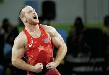  ?? MARKUS SCHREIBER — ASSOCIATED PRESS ?? Kyle Snyder reacts after defeating Elizbar Odikadze during the men’s 97-kilogram freestyle wrestling competitio­n at the 2016 Summer Olympics in Rio de Janeiro, Brazil.