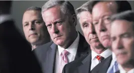  ?? J. Scott Applewhite ?? The Associated Press House Freedom Caucus Chairman Rep. Mark Meadows, R-N.C., second from left, and others participat­e in a news conference Wednesday on Capitol Hill. Meadows said his group wants to delay the House’s traditiona­l August recess until...