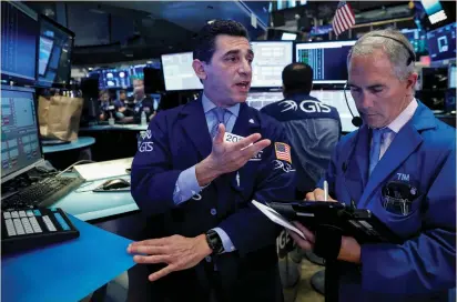  ?? (Brendan McDermid/Reuters) ?? TRADERS WORK on the floor of the New York Stock Exchange yesterday. Bets on a near-term interest-rate increase firmed following comments from Federal Reserve Chairwoman Janet Yellen, who said on Tuesday that the US central bank needs to continue...