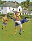  ?? 01_B28footy02 ?? Owen ‘Pele’ Quigley outjumps an opposition player.