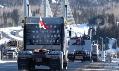  ?? January. Photograph: Canadian Press/REX/Shuttersto­ck ?? Protesters drive over the Nipigon Bridge on the Trans Canada Highway as part of a trucking convoy against Covid vaccine mandates on 27