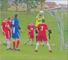  ??  ?? Saints keeper Graham Douglas safely gathers this Gary Pettigrew corner kick.