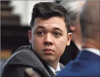  ?? Sean Krajacic /Pool / Getty Images ?? Kyle Rittenhous­e looks back as attorneys discuss items in the motion for mistrial presented by his defense during his trial Wednesday at the Kenosha County Courthouse in Kenosha, Wis.