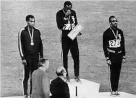  ?? AFP VIA GETTY IMAGES ?? Mr. Hines (center) stood on the podium on Oct. 14, 1968, after receiving his gold medal at the Mexico Olympic Games.