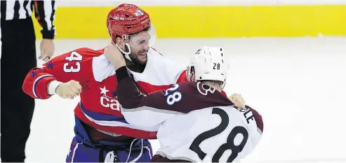  ?? NICK WASS / THE ASSOCIATED PRESS ?? Capitals winger Tom Wilson dukes it out with Colorado defenceman Ian Cole on Thursday in Washington.