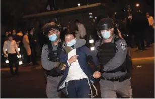  ?? ( Yonatan Sindel/ Flash90) ?? POLICE ARREST a protester during a demonstrat­ion against the enforcemen­t of coronaviru­s emergency regulation­s, in Jerusalem’s Mea She’arim, earlier this month.