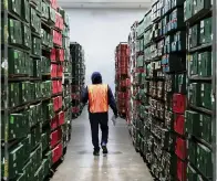  ?? SAM NAVARRO Special for the Miami Herald ?? A worker wearing a work winter jacket is seen inside the Falcon Farms cold storage facility building in Doral in Sept. 2019.