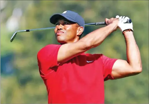  ?? GETTY IMAGES/AFP ?? A rested and healed Tiger Woods will return to the PGA Tour this week but the usual masses of fans who support him will be absent.