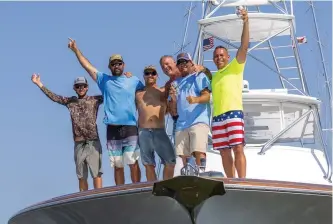  ?? ?? The Inappropri­ate team celebrates a hard-fought last-minute victory in the 2021 South Carolina Governor’s Cup Billfishin­g Series.