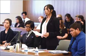  ?? RECORDER PHOTOS BY CHIEKO HARA ?? Left: Judge Glade Roper gives some profession­al advice to members of Granite Hills High School’s Mock Trial team. Right: Granite Hills High School’s Araceli Vasquez asks questions to a witness during her portrayal as a prosecutor of a mock trial cased called ‘People vs. Klein’ Thursday, Oct. 25, at the South County Justice Center in Portervill­e.