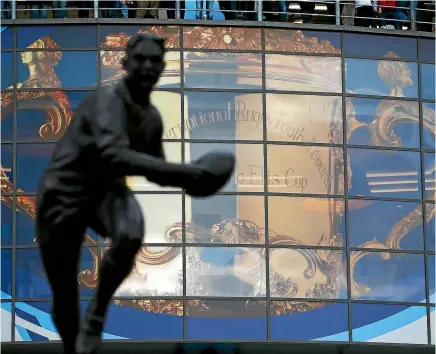  ?? MIKE HEWITT/GETTY IMAGES ?? A giant screen displays an image of the Webb Ellis Trophy during the 2015 Rugby World Cup at Twickenham in London.