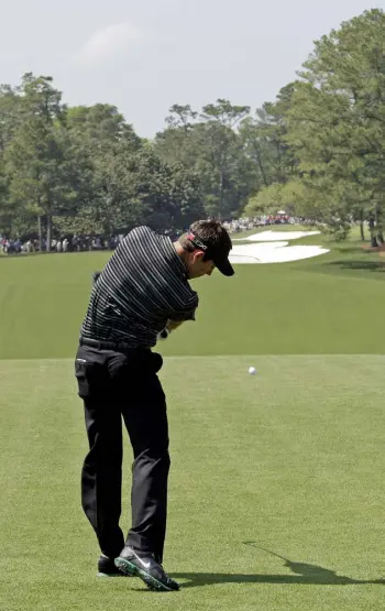  ?? Charlie Riedel, The Associated Press ?? Charl Schwartzel tees off on the first hole during the final round of the Masters golf tournament in 2011, in Augusta, Ga. Schwartzel made one of the more remarkable birdies on the hole known as "Tea Olive."