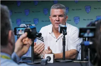  ?? Katharine Lotze/The Signal ?? Arizona State University head football coach Todd Graham talks to the press during the second day of the Pac-12 Media Days at the Ray Dolby Ballroom in Hollywood on Thursday.
