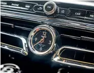  ??  ??  ‘Sculptural’ central air vents are different from the Continenta­l GT’S. The surrounds are chrome, like that of the clock, and can be knurled on request.