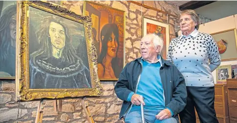  ??  ?? PROUD PARENTS: Peter Sr and Louise Cura with one of Pete’s self portraits in his Cupar gallery.