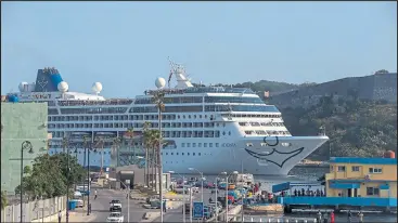  ??  ?? Carnival’s Adonia cruise ship is difficult to miss as it arrives from Miami in Havana, Cuba