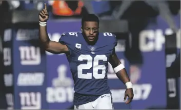  ?? AP PHOTO/ADAM HUNGER ?? New York Giants running back Saquon Barkley is introduced before an NFL football game against the Indianapol­is Colts on Jan. 1 in East Rutherford, N.J.