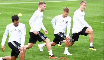  ??  ?? (From left) Germany’s defender Mats Hummel, Germany’s striker Marco Reus, Germany’s defender Joshua Kimmich and Germany’s striker Nils Petersen stretch during a training session of the German national football team in Munich, southern Germany. — AFP photo