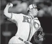  ?? ?? PITCHER KRIS BUBIC and the Royals wore replica uniforms of the 1944 Kansas City Monarchs.